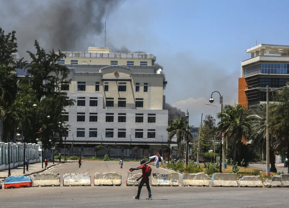 A man walks past, near the National Palace in Port-au-Prince, Haiti, on April 2, 2024. (The Canadian Press/AP Odelyn Joseph)