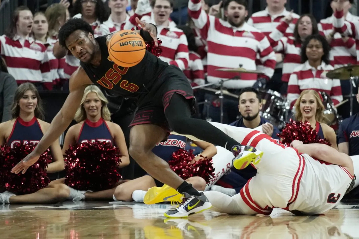 Southern California guard Bronny James (6) scrambles for the bal lwith Arizona guard Pelle Larsson (3) during the first half of an NCAA college basketball game in the quarterfinal round of the Pac-12 tournament in Las Vegas on March 14, 2024. (John Locher/AP Photo)