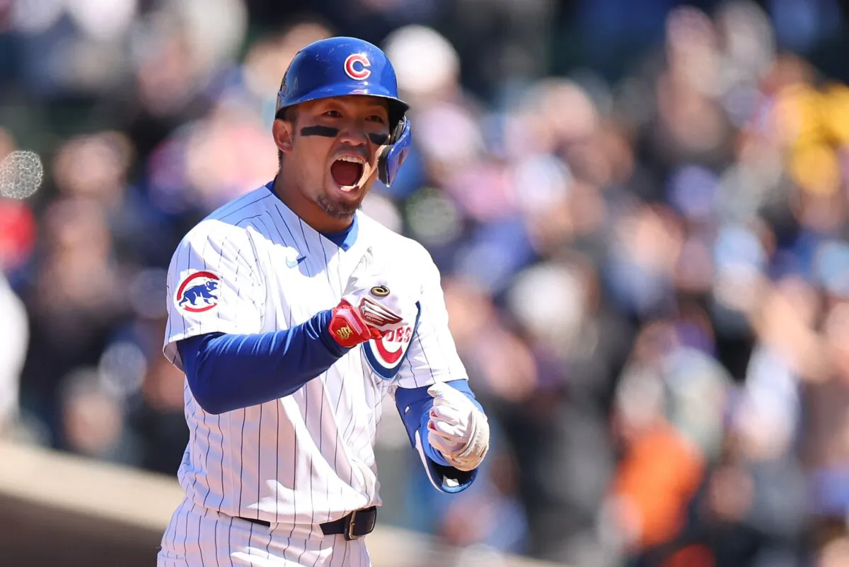 Seiya Suzuki (27) of the Chicago Cubs celebrates after hitting a two-RBI double during the second inning against the Los Angeles Dodgers in Chicago on April 5, 2024. (Michael Reaves/Getty Images)