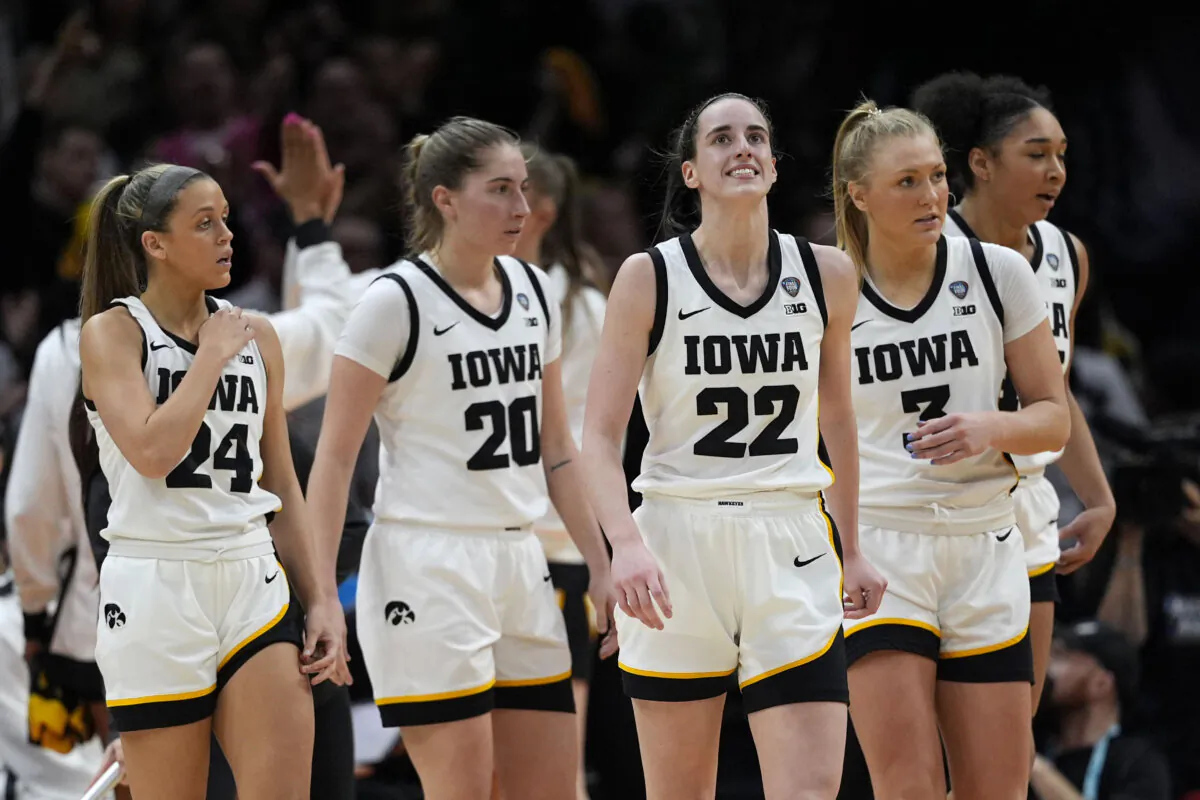 Iowa guard Caitlin Clark (22) reacts after making a three-point basket during the second half of a Final Four college basketball game against UConn in the women's NCAA Tournament  in Cleveland April 5, 2024. (Carolyn Kaster/AP Photo)