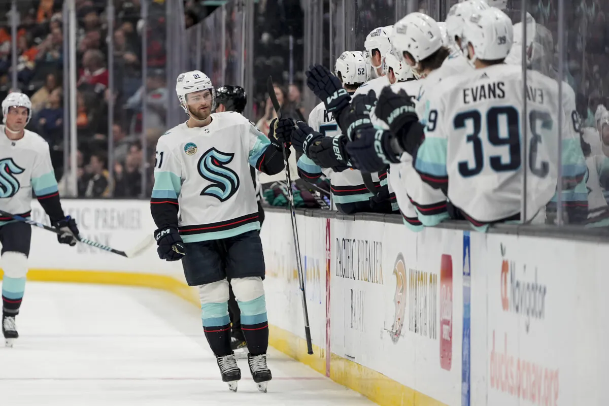 Seattle Kraken center Shane Wright (CL) celebrates after his goal with the bench during the first period of an NHL hockey game against the Anaheim Ducks in Anaheim, Calif., on April 5, 2024. (Ryan Sun/AP Photo)