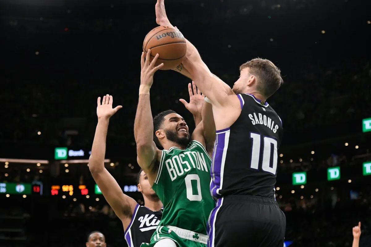 Boston Celtics forward Jayson Tatum (0)  shoots  against Sacramento Kings forward Domantas Sabonis (10) during the first half in Boston on Apr. 5, 2024.   (Eric Canha/USA TODAY Sports via Field Level Media)