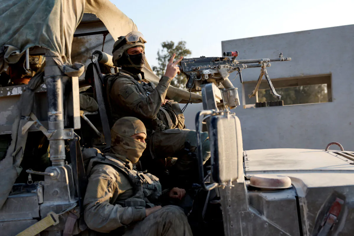Israeli soldiers prepare to enter Gaza on April 7, 2024. (Amir Cohen/Reuters)