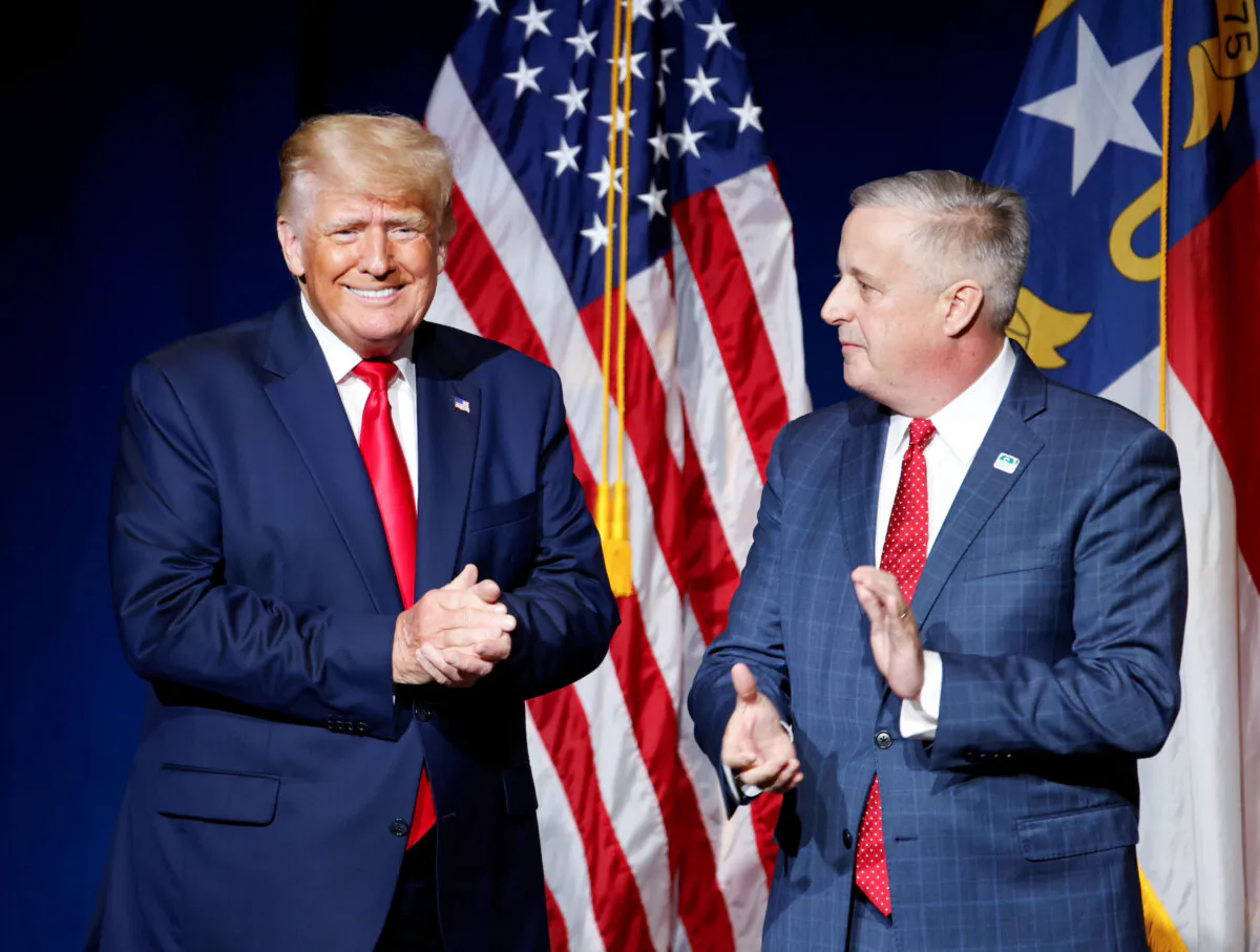 Former U.S. President Donald Trump is introduced by North Carolina Republican Party chairman Michael Whatley before speaking at the North Carolina GOP convention dinner in Greenville, N.C., on June 5, 2021. (Jonathan Drake/Reuters)