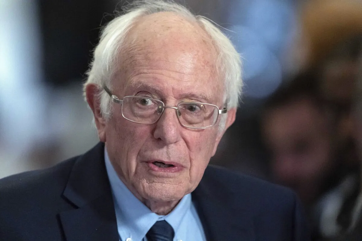 Sen. Bernie Sanders (I-Vt.) talks to the media as he walks to the House chamber before President Joe Biden's State of the Union address at the U.S. Capitol in Washington on March 7, 2024. (Jose Luis Magana/AP Photo)