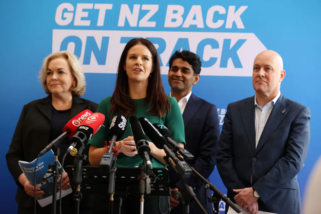 Prime Minister Christopher Luxon (R) is joined by Immigration Minister Erica Stanford (C) as National announces policy aiming to boost the tech sector at Future House in Parnell in Auckland, New Zealand, on Sept. 15, 2023. (Fiona Goodall/Getty Images)