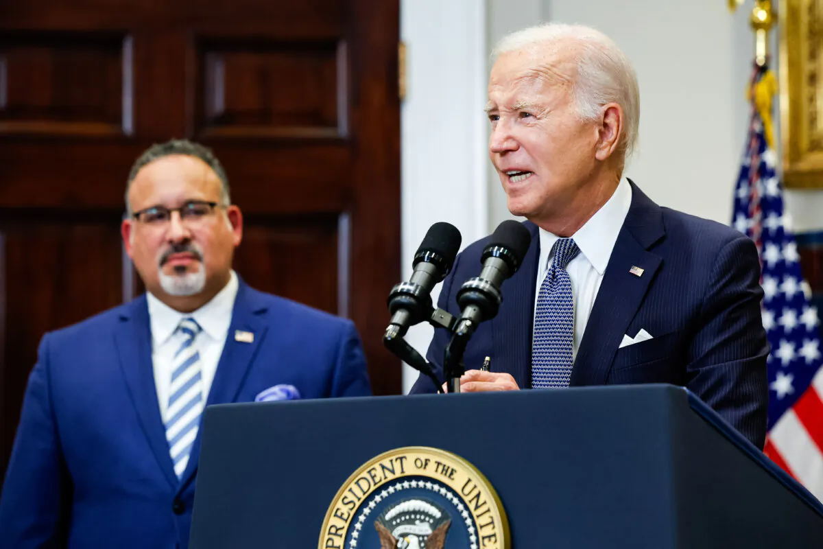 President Joe Biden is joined by Education Secretary Miguel Cardona as he announces new actions to protect borrowers after the Supreme Court struck down his student loan forgiveness plan in the Roosevelt Room at the White House on June 30, 2023. (Chip Somodevilla/Getty Images)