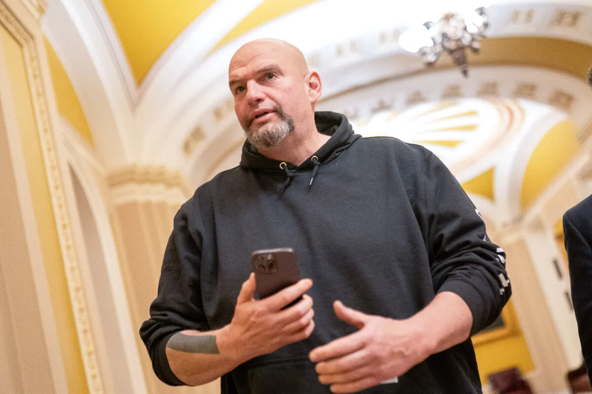 U.S. Sen. John Fetterman (D-Pa.) walks toward the Senate Chambers in Washington, D.C., on March 23, 2024. (Nathan Howard/Getty Images)