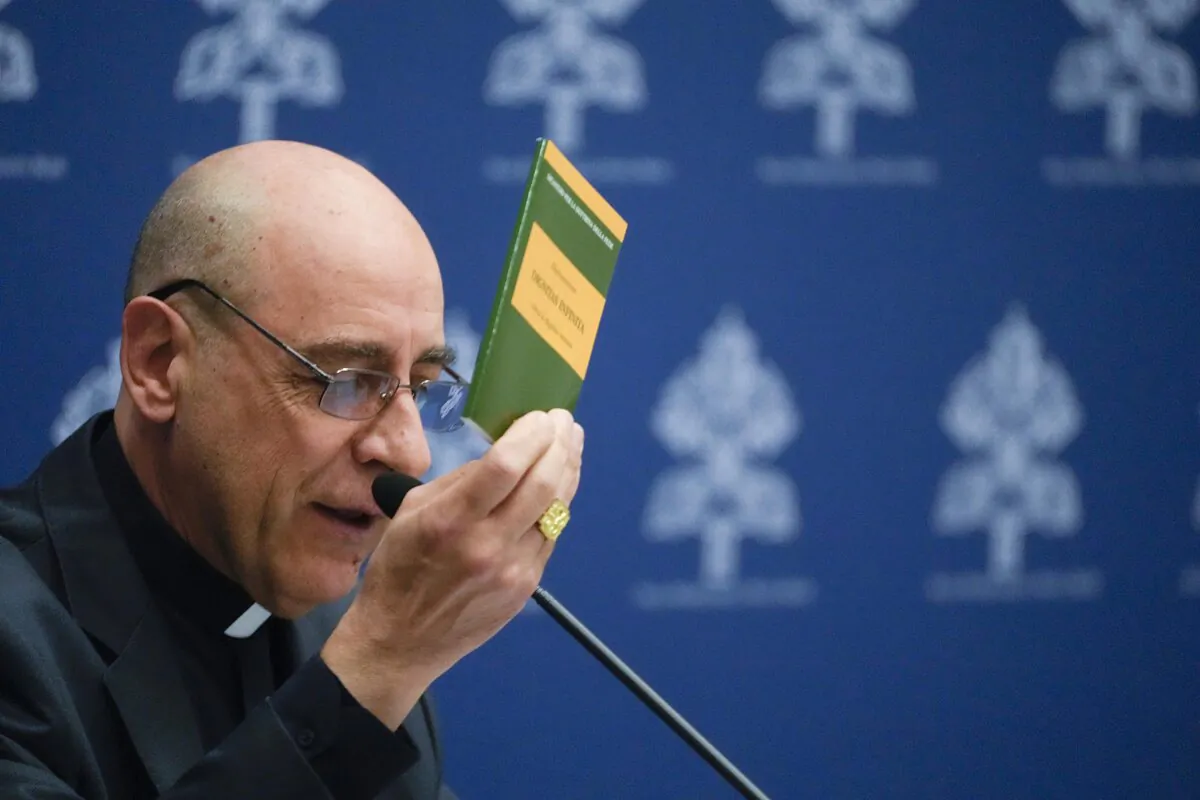 The prefect of the Vatican's Dicastery for the Doctrine of the Faith, Cardinal Victor Manuel Fernandez, presents the declaration 'Dignitas Infinita' (Infinite Dignity) during a press conference at the Vatican on April 8, 2024. (AP Photo/Gregorio Borgia)