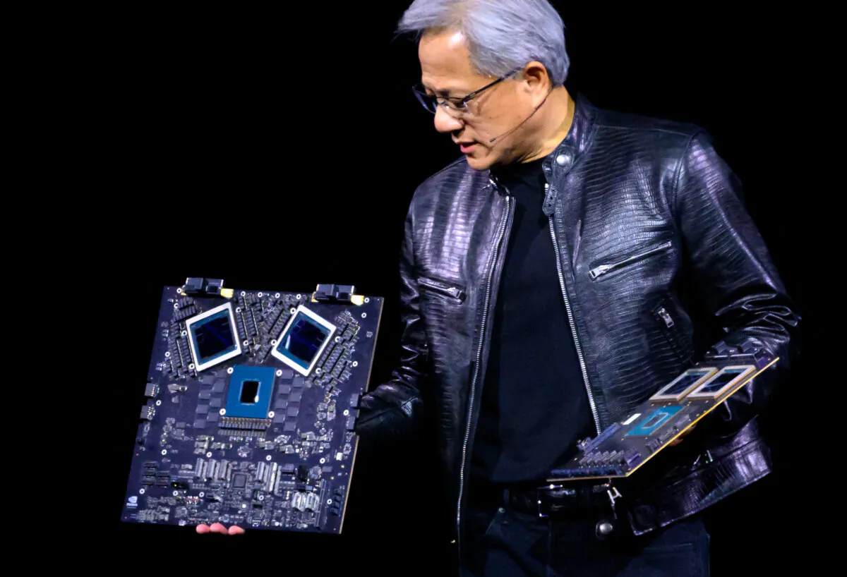 NVIDIA's CEO Jensen Huang displays products on-stage during the annual Nvidia GTC Artificial Intelligence Conference at SAP Center in San Jose, Calif., on March 18, 2024. (Josh Edelson/ AFP via Getty Images)