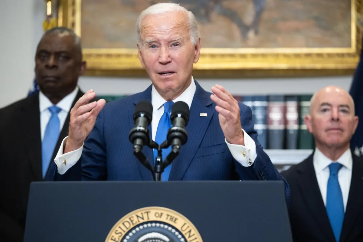 Defense Secretary Lloyd Austin (L) and Homeland Security Secretary Alejandro Mayorkas (R) look on as President Joe Biden speaks in the Roosevelt Room of the White House in Washington, D.C., on Aug. 30, 2023. (Saul Loeb/AFP via Getty Images)