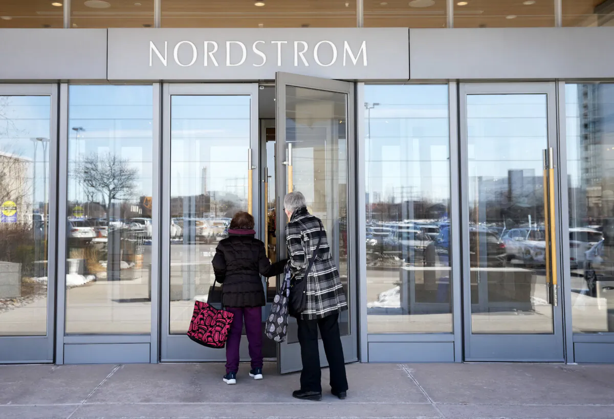 People enter a Nordstrom department store at Sherway Gardens in Toronto on March 9, 2023. After Nordstrom closed all its Canadian stores last June, 2,500 jobs were lost. (The Canadian Press/Nathan Denette) 