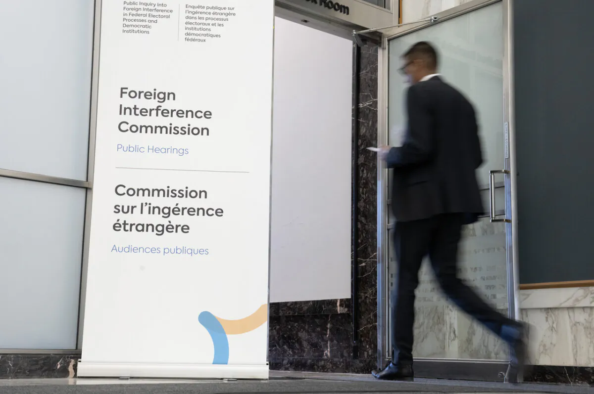 A person enters the Public Inquiry Into Foreign Interference in Federal Electoral Processes and Democratic Institutions in Ottawa on April 8, 2024. (The Canadian Press/Adrian Wyld)