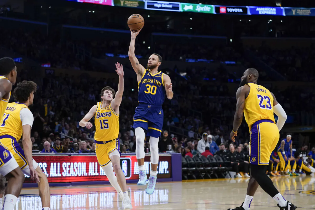 Golden State Warriors star Stephen Curry avoids the Los Angeles Lakers' defense in Los Angeles on April 9, 2024. (Ryan Sun/AP Photo)