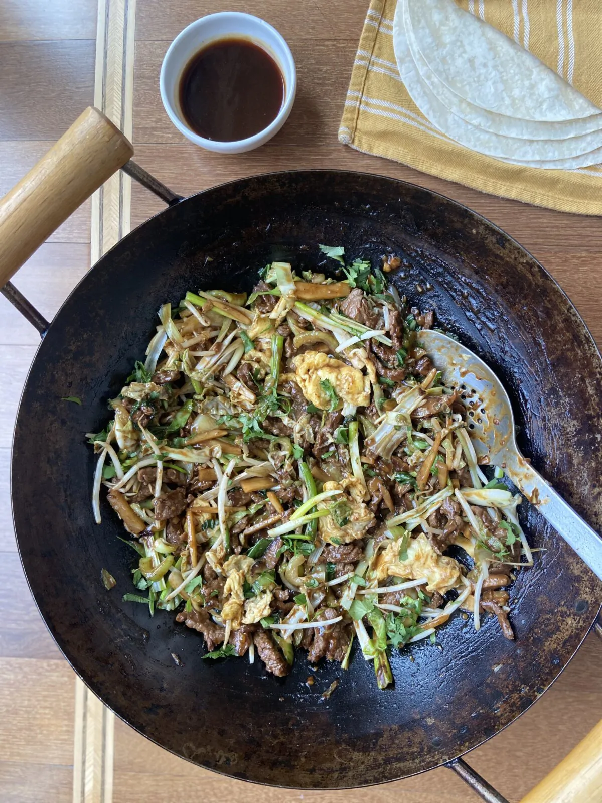 Quickly cooked beef, with an abundance of vegetables tucked in a wrapper, moo shu style, will be a family favorite. (JeanMarie Brownson/TNS)