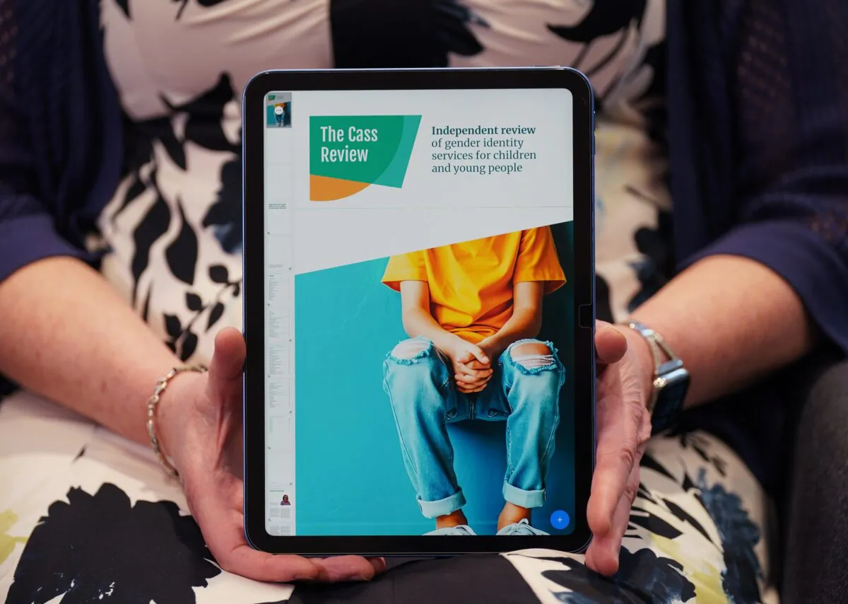Retired consultant paediatrician Dr. Hilary Cass holding a digital copy of her review of gender care of children and young people, in London on April 9, 2024. (Yui Mok/PA)