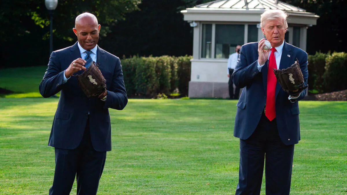President Donald Trump plays ball with Mariano Rivera, the MLB Hall of Fame closer from the New York Yankees, during a Major League Baseball Opening Day event at the White House in Washington on July 23, 2020. (Jim Watson/AFP via Getty Images)