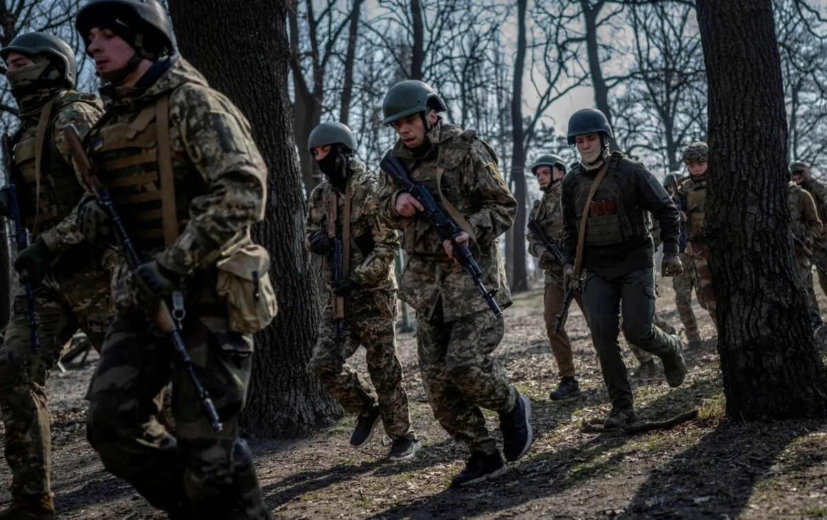 Volunteers who aspire to join the 3rd Separate Assault Brigade of the Ukrainian Armed Forces take part in a basic training, in Kyiv region, Ukraine, on March 5, 2024. (Viacheslav Ratynskyi/Reuters)