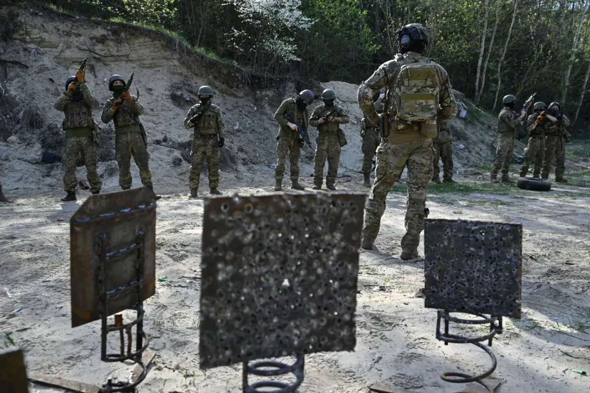 Members of the Siberian battalion within the Ukrainian Armed Forces take part in a military training exercise on a shooting range in Kyiv region on April 10, 2024. (Genya Savilov/AFP via Getty Images)