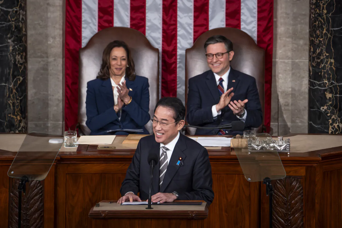 Japanese Prime Minister Fumio Kishida (C) gives a speech in Congress while Vice President Kamala Harris and House Speaker Rep. Mike Johnson (R-La.) listen in Washington on April 11, 2024. (Madalina Vasiliu/The Epoch Times)