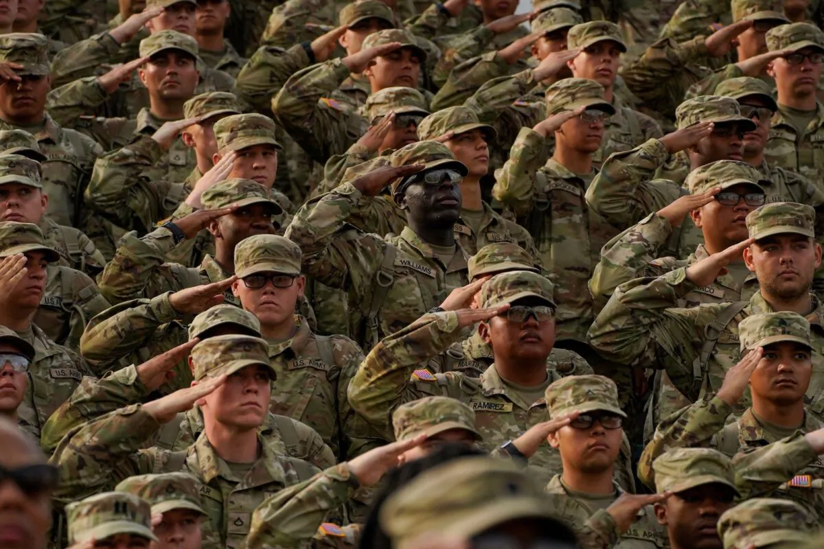 Members of the U.S. Army salute during a ceremony at Fort Moore, Georgia, on May 11, 2023. (Cheney Orr/AFP via Getty Images)