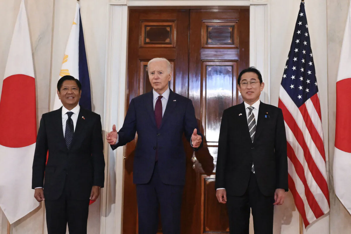 President Joe Biden speaks to reporters with Japanese Prime Minister Fumio Kishida (R) and Philippine President Ferdinand Marcos Jr. (L) at the White House in Washington on April 11, 2024. (Andrew Caballero-Reynolds/AFP via Getty Images)