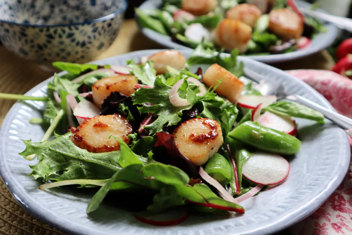 Pan-seared scallops top this seasonal salad with sugar snap peas and fresh radish. (Gretchen McKay/Pittsburgh Post-Gazette/TNS)