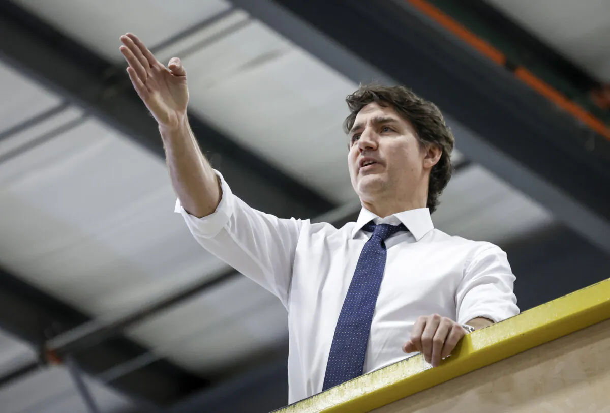 Prime Minister Justin Trudeau tours modular home construction facility before making a housing announcement in Calgary, Alta., on April 5, 2024. (The Canadian Press/Jeff McIntosh)