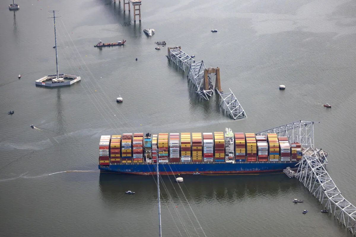 The cargo ship Dali sits in the water after running into and knocking down the Francis Scott Key Bridge, in Baltimore, Md., on March 26, 2024. (Tasos Katopodis/Getty Images)