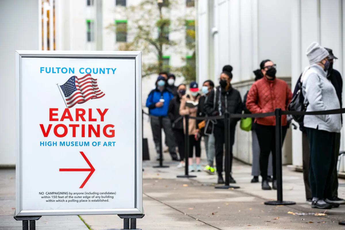 Voters wait in line to cast their ballots during the first day of early voting in the U.S. Senate runoff, in Atlanta on Dec. 14, 2020. (Jessica McGowan/Getty Images)