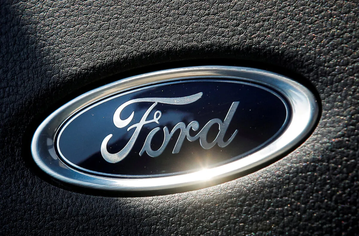 The Ford name plate is seen on the interior of a Ford F-150 Lightning pickup truck during a press event in New York on May 26, 2021. (Brendan McDermid/Reuters)