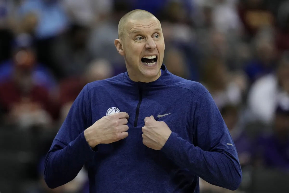 BYU head coach Mark Pope talks to his players during the first half of an NCAA college basketball game against UCF in Kansas City, Mo., March 13, 2024. (Charlie Riedel/AP Photo)