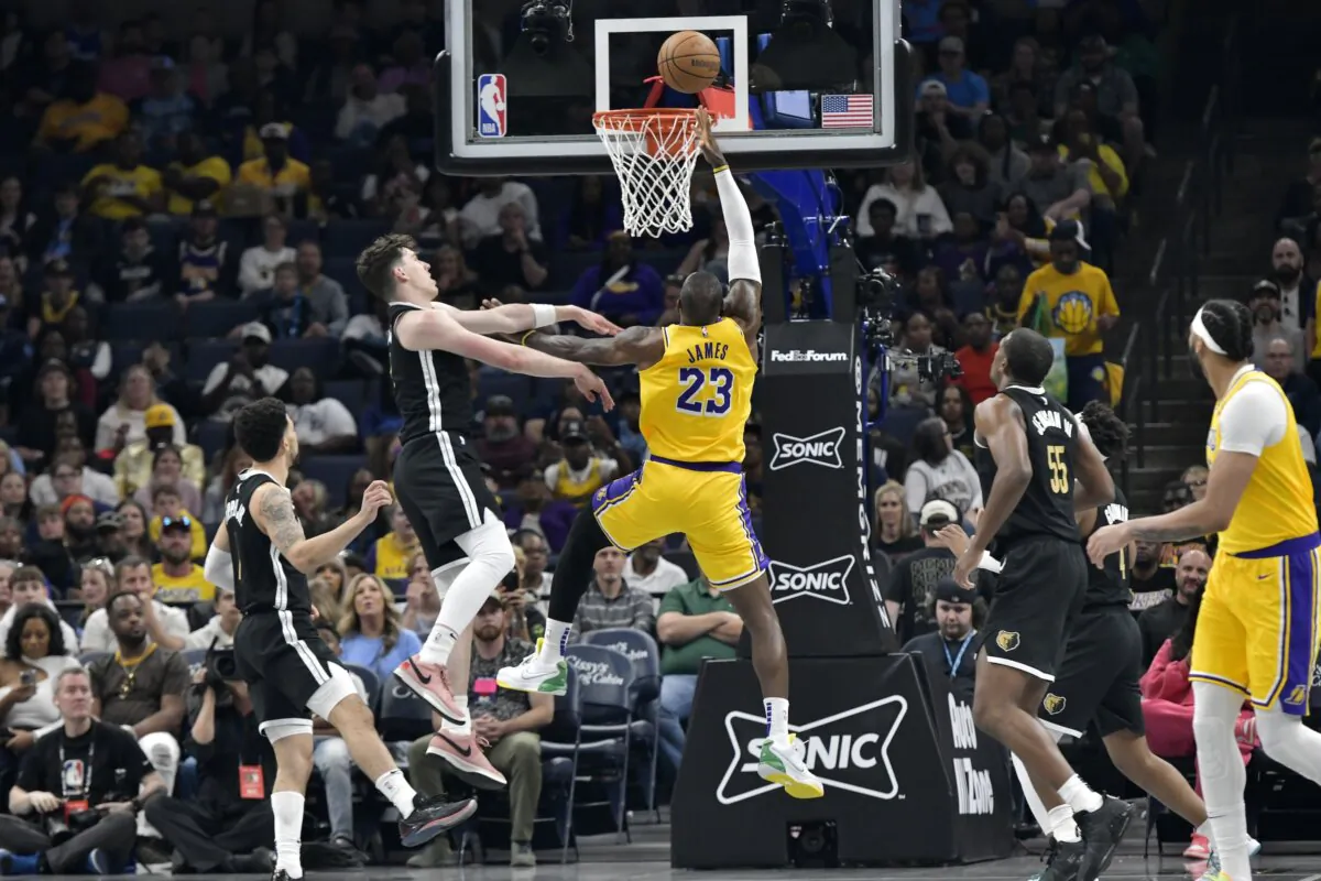 Los Angeles Lakers forward LeBron James (23) shoots against Memphis Grizzlies forward Jake LaRavia during the first half of an NBA basketball game in Memphis on April 12, 2024. (Brandon Dill/AP Photo)