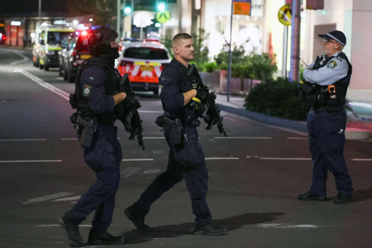 Armed police patrol outside the Westfield Bondi Junction shopping mall after a stabbing incident in Sydney on April 13, 2024. (David Gray/ AFP via Getty Images)