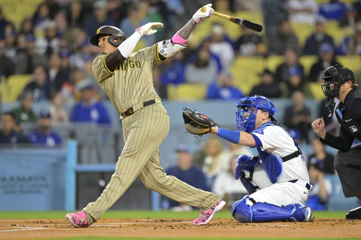 Manny Machado (13) of the San Diego Padres hits a two run home run in the first inning against the Los Angeles Dodgers in Los Angeles on April 12, 2024. (Jayne Kamin-Oncea/Getty Images)