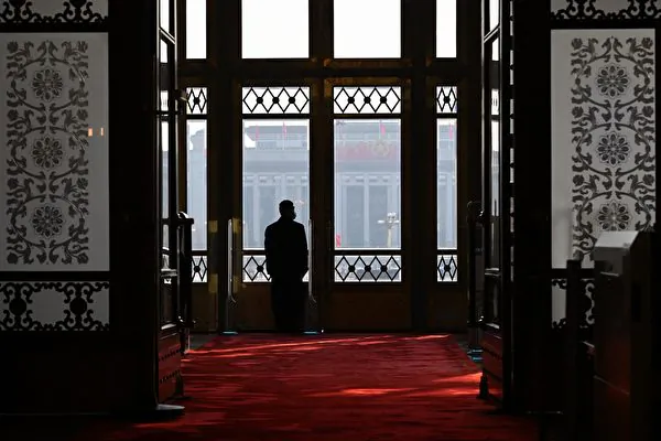 A security guard stands at the entrance during the closing ceremony of the Chinese People's Political Consultative Conference (CPPCC) at the Great Hall of the People in Beijing on March 10, 2024. (Photo by Jade Gao / AFP)