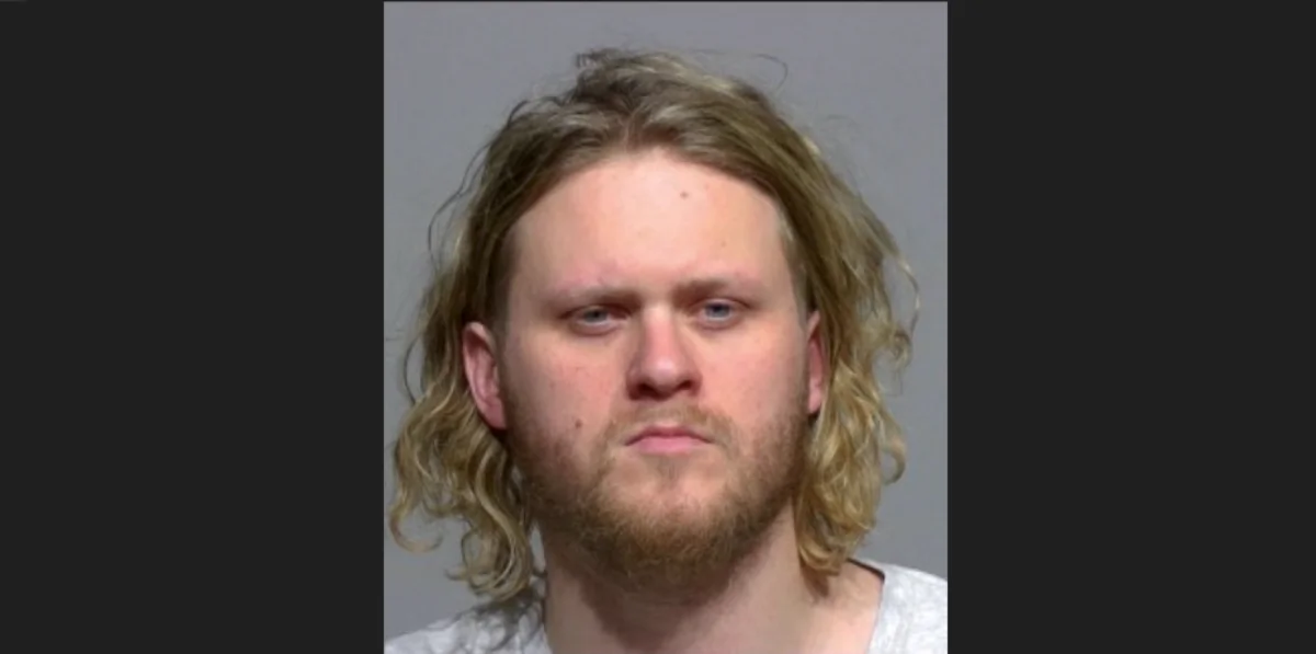 This booking photo released by the Milwaukee County, Wis., Sheriff's Office shows Maxwell Anderson, who was charged Friday, April 12, 2024, in the slaying of a woman whose dismembered leg was found near a beach down a bluff along Lake Michigan near Milwaukee. Anderson, 33, faces charges of first-degree intentional homicide, mutilating a corpse and arson, according to a criminal complaint filed in Milwaukee County circuit court. (Milwaukee County Sheriff's Office via AP)