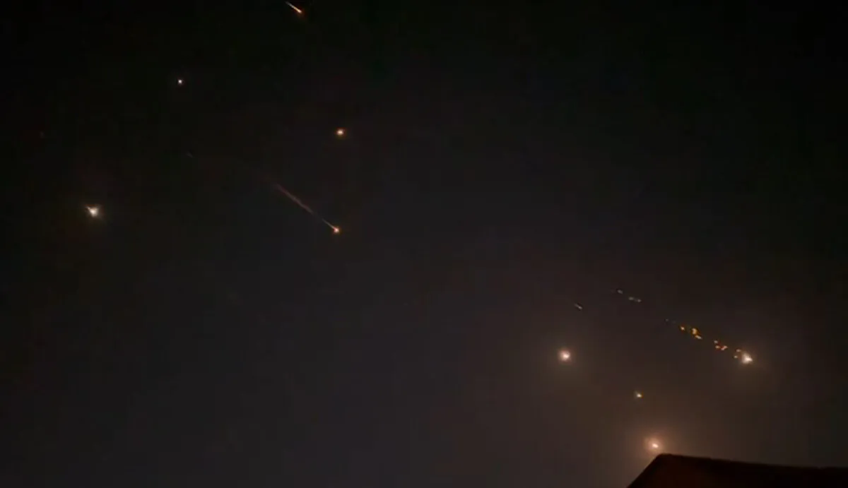 Explosions light up the sky in Hebron, West Bank, during an Iranian attack on Israel, on April 14, 2024, in a still from video. (AFPTV/AFP via Getty Images)