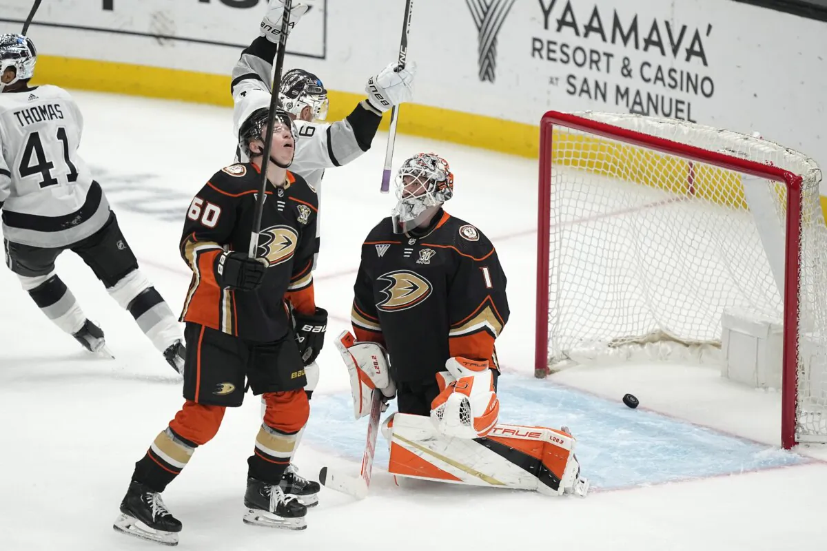 Los Angeles Kings center Trevor Lewis (2nd from R) celebrates a goal by defenseman Matt Roy as Anaheim Ducks defenseman Jackson LaCombe (2nd from L), and goaltender Lukas Dostal (R) react during the second period of an NHL hockey game in Los Angeles on April 13, 2024. (Mark J. Terrill/AP Photo)