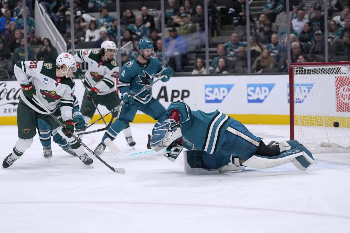 Minnesota Wild left wing Liam Ohgren (28) scores a goal past San Jose Sharks goaltender Mackenzie Blackwood (R) during the second period of an NHL hockey game in San Jose, Calif., on April 13, 2024. (Tony Avelar/AP Photo)
