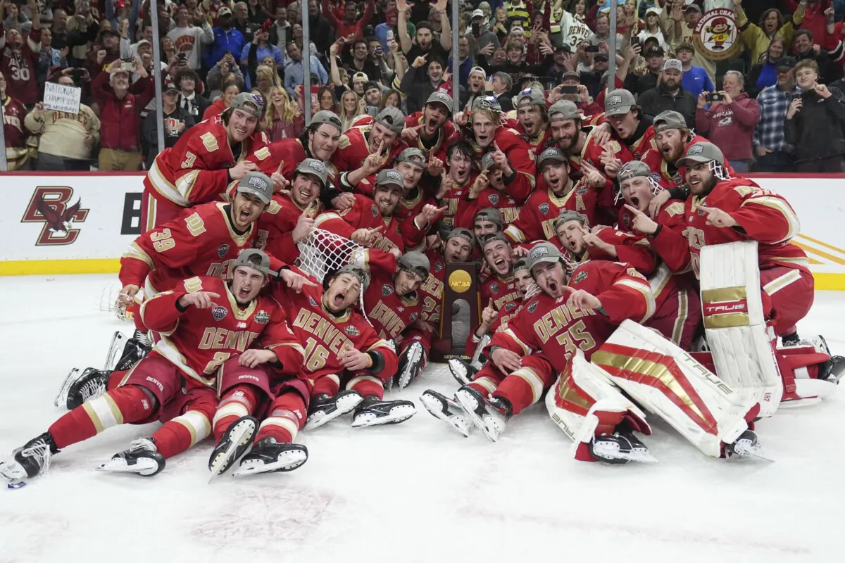 Denver poses with the championship trophy after defeating Boston College in the championship game of the Frozen Four NCAA college hockey tournament in St. Paul, Minn., on April 13, 2024. (Abbie Parr/AP Photo)