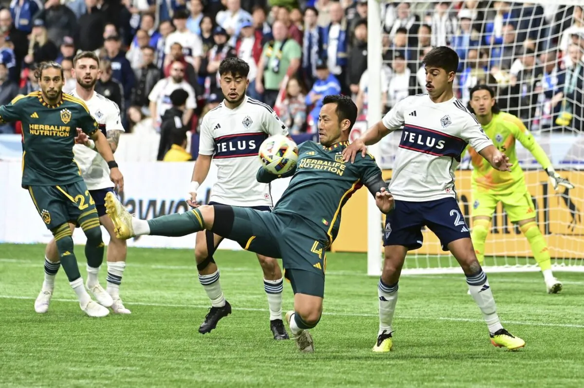 LA Galaxy defender Maya Yoshida (4) defends the ball against Vancouver Whitecaps FC defender Mathias Laborda (2) during the first half at BC Place in Vancouver on Apr 13, 2024. (Simon Fearn/USA TODAY Sports via Field Level Media)