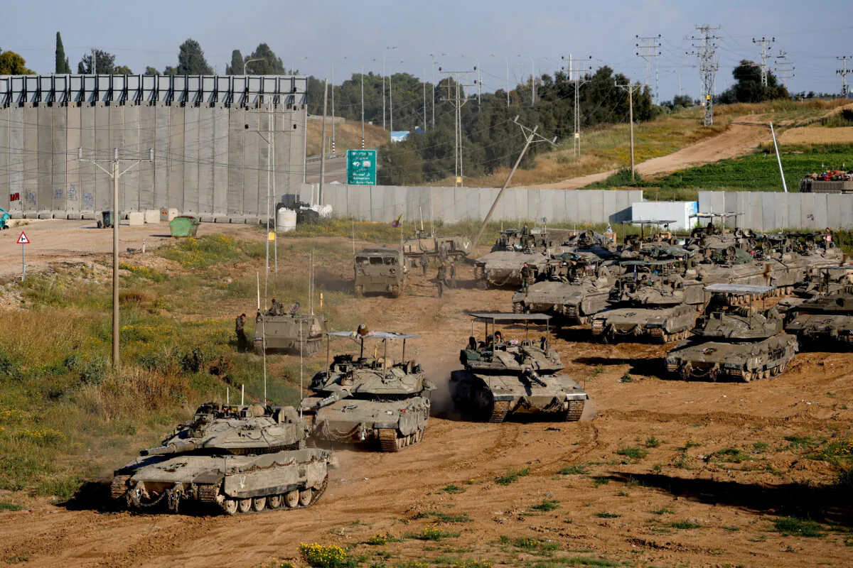 Israeli tanks maneuver on their way to Gaza, near the Israel–Gaza border, in Israel, on April 10, 2024. (Amir Cohen/Reuters)