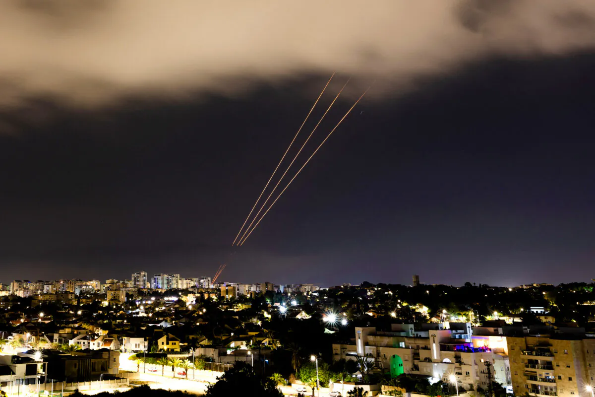 An anti-missile system operates after Iran launched drones and missiles towards Israel, as seen from Ashkelon, Israel, on April 14, 2024. (Amir Cohen/Reuters)