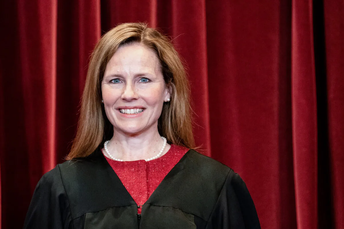 Associate Justice Amy Coney Barrett stands during a group photo of the justices at the Supreme Court in Washington on April 23, 2021. (Erin Schaff/AFP via Getty Images)