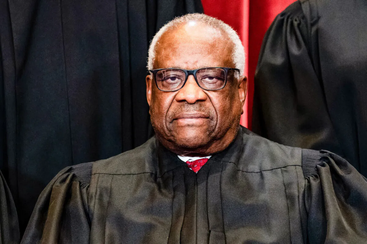 Supreme Court Justice Clarence Thomas sits during a group photograph of the justices at the Supreme Court in Washington, on April 23, 2021. (Erin Schaff/Pool/AFP via Getty Images)