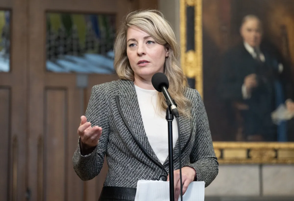 Foreign Affairs Minister Melanie Joly speaks with reporters in the foyer of the House of Commons in Ottawa, on April 15, 2024. (The Canadian Press/Adrian Wyld)