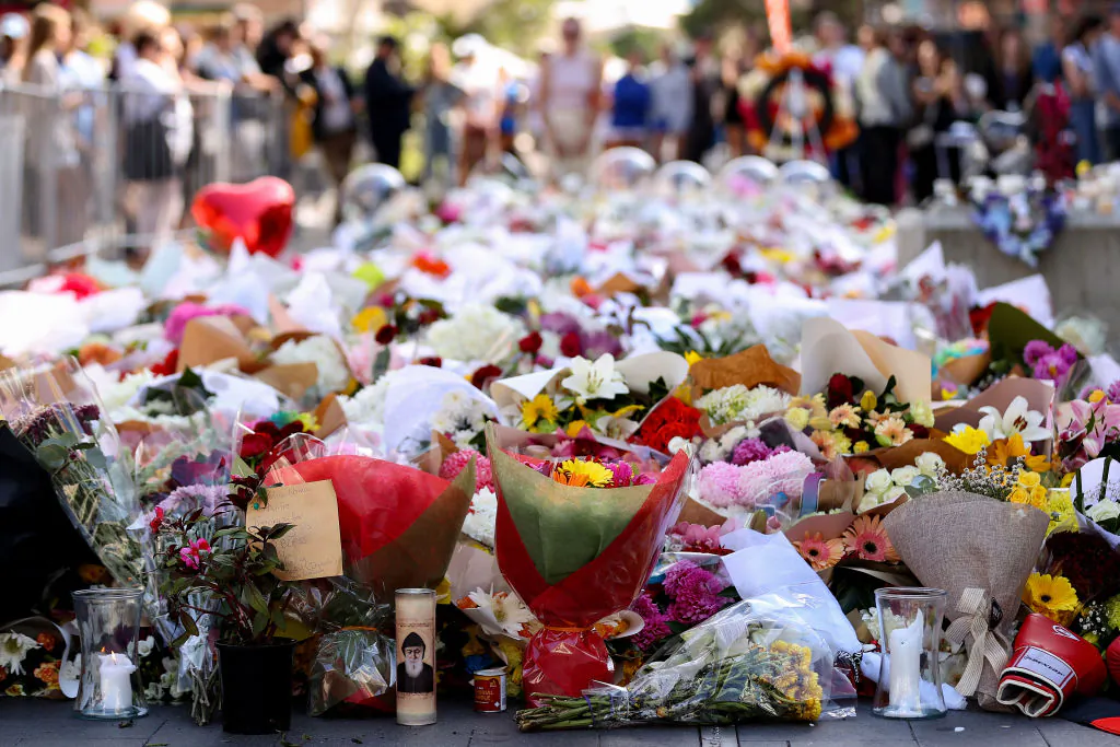 Flowers are placed outside Westfield Shopping mall in honour of the victims in Bondi Junction, Australia, on April 16, 2024. (Brendon Thorne/Getty Images)