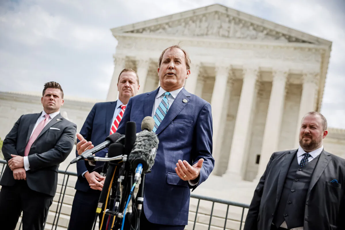 Texas Attorney General Ken Paxton (C) talks to reporters with Missouri Attorney General Eric Schmitt (2nd L) and Texas Solicitor General Judd Stone (R) in front of the U.S. Supreme Court in Washington on April 26, 2022. (Chip Somodevilla/Getty Images)