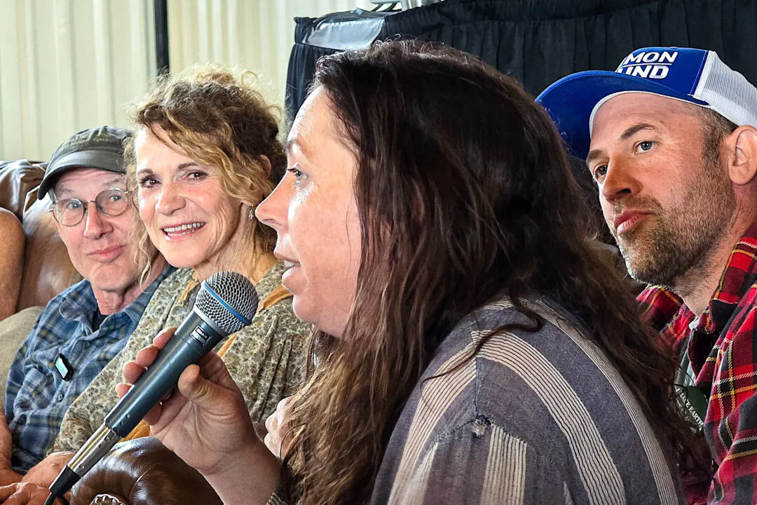 Mollie Engelhart and family members address an audience during Confluence 2024 at Sovereignty Ranch in Bandera, Texas, on April 5, 2024. (Allan Stein/The Epoch Times)